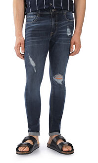 Jeans Super Skinny Tapered Con Destrucciones